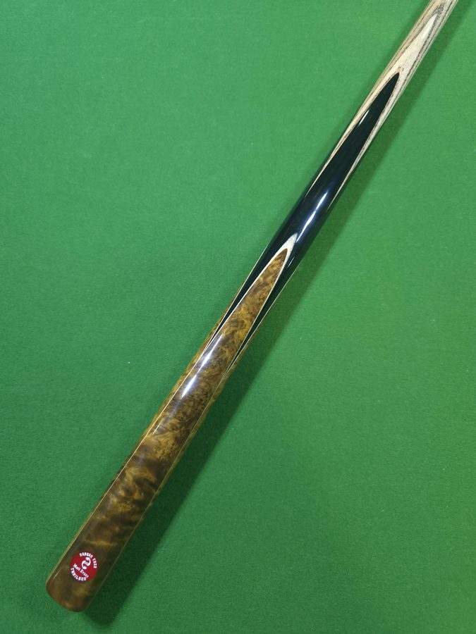 Close-up of a one-off cue and its butt medallion