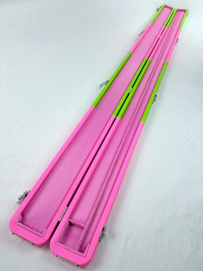 A matching pair of neon pink and green cue cases